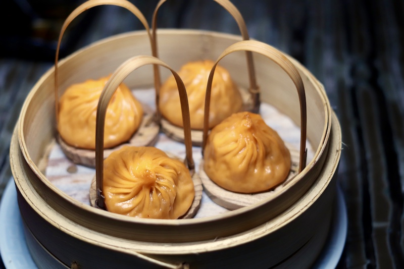 Mott 32 Hot and Sour Iberico Pork Soup Dumplings - Best Hong Kong Restaurants - Photo by Indulgent Eats