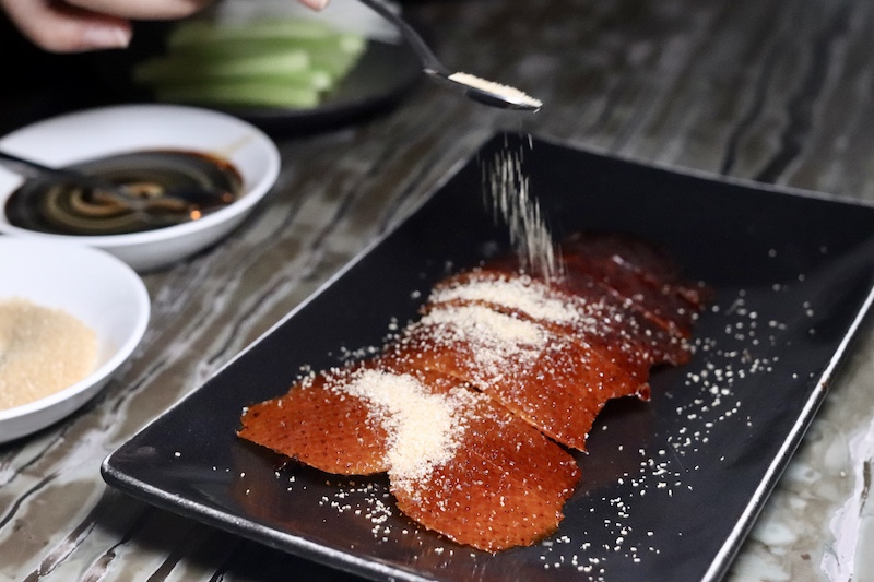 Mott 32 Peking Duck Skin with Brown Sugar - Best Hong Kong Restaurants - Photo by Indulgent Eats