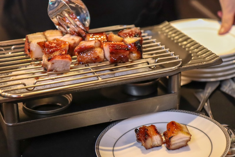 Ding's Club Hong Kong - Barbecued Pluma Pork being plated - Photo by Indulgent Eats