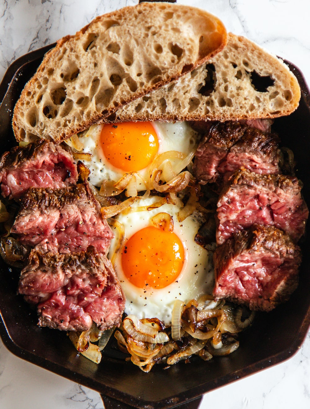 Breakfast Steak and Eggs Skillet Caramelized Onions Recipe Close Up - Indulgent Eats-min