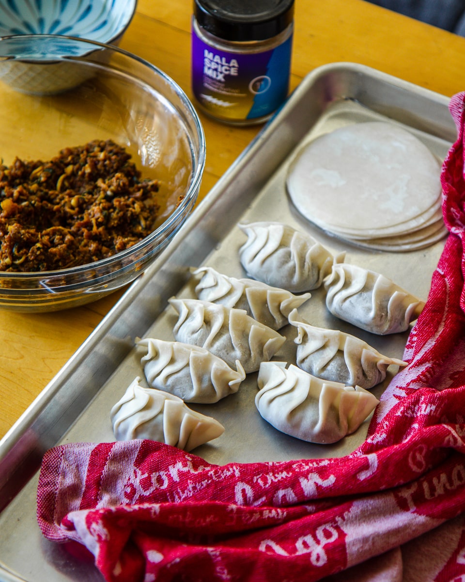 Spicy Cumin Lamb Dumplings Recipe with Fly by Jing Sichuan Chili Crisp Oil - Pleated Dumplings with Filling