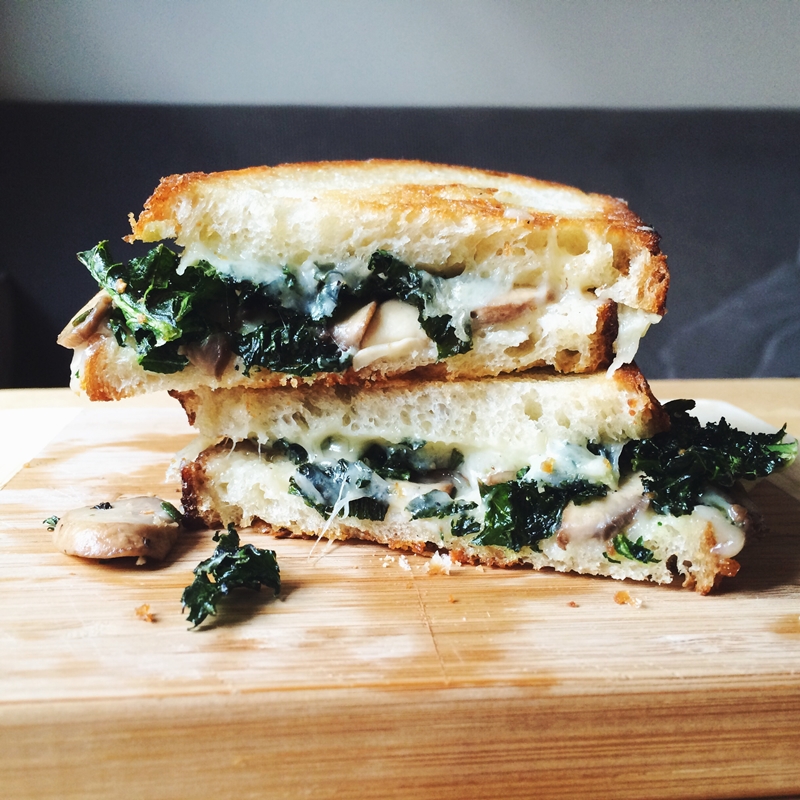 Gruyere Grilled Cheese with Kale Chips and Rosemary Mushrooms Sliced Side View