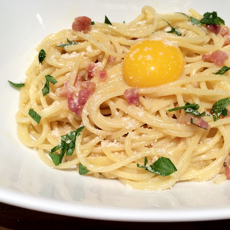 Spaghetti alla Carbonara Topped with Yolk Recipe Closeup
