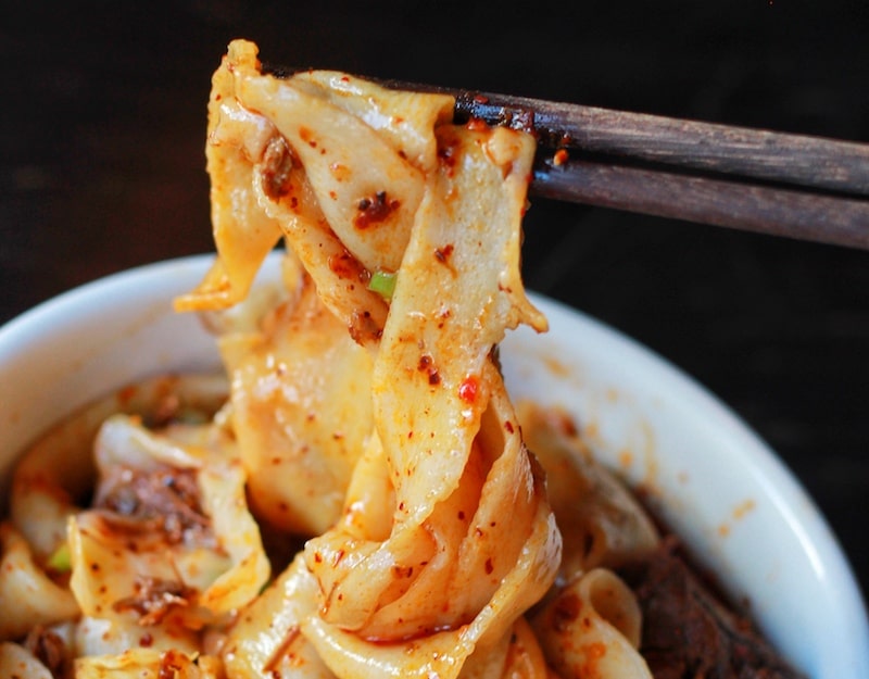 Best NYC Restaurants - Xian Foods Spicy Cumin Lamb Noodles - Photo by Indulgent Eats